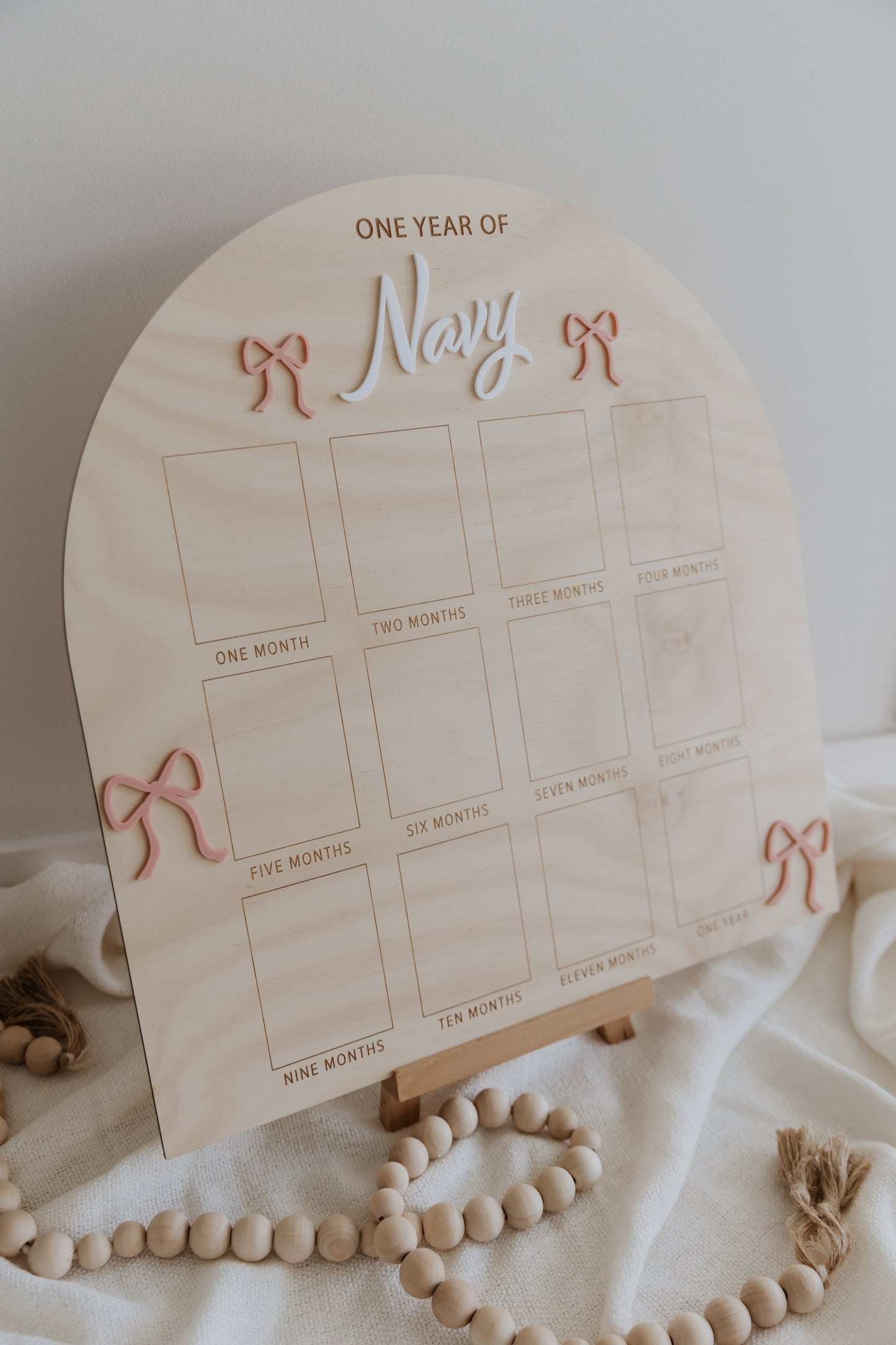 First Birthday photo board, wooden engraved sign for child's 1st birthday with pink bow design, one year of board