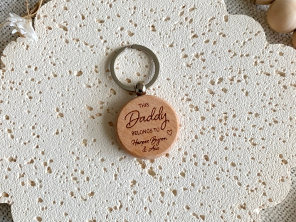 Wooden keychain with 'This Daddy belongs to' engraving. Engraved Keyring gift for Father's Day