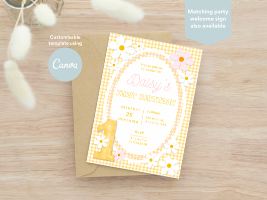 Yellow and PInk Daisy themed customisable first birthday party invitation. A first birthday invitation card with a yellow gingham border, white daisy flowers, and a large yellow number 1, shown on top of a kraft envelope on a light wood surface. Text overlays mention Canva and customizable template use.