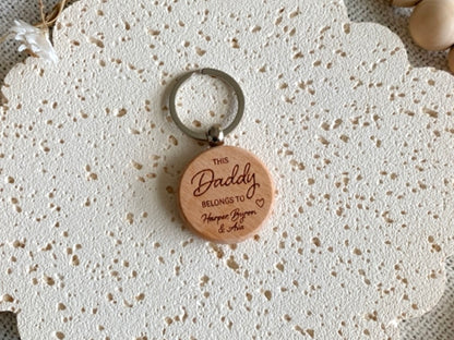 Wooden keychain with 'This Daddy belongs to' engraving. Engraved Keyring gift for Father's Day